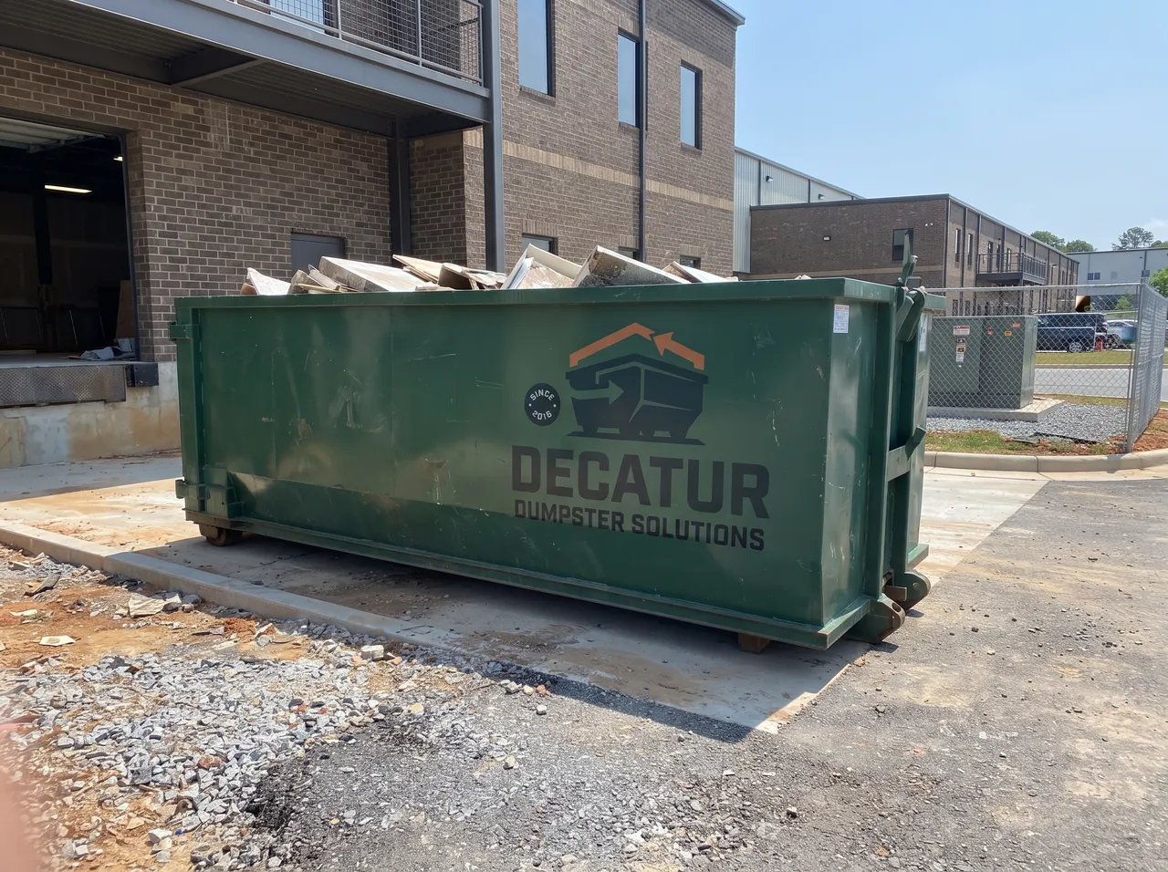 Green roll-off dumpster available for rental in Macon, Illinois